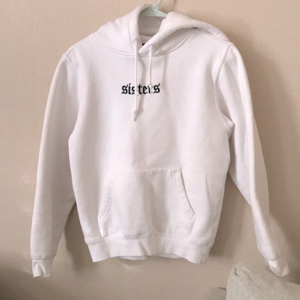 James Charles Sister white sweater